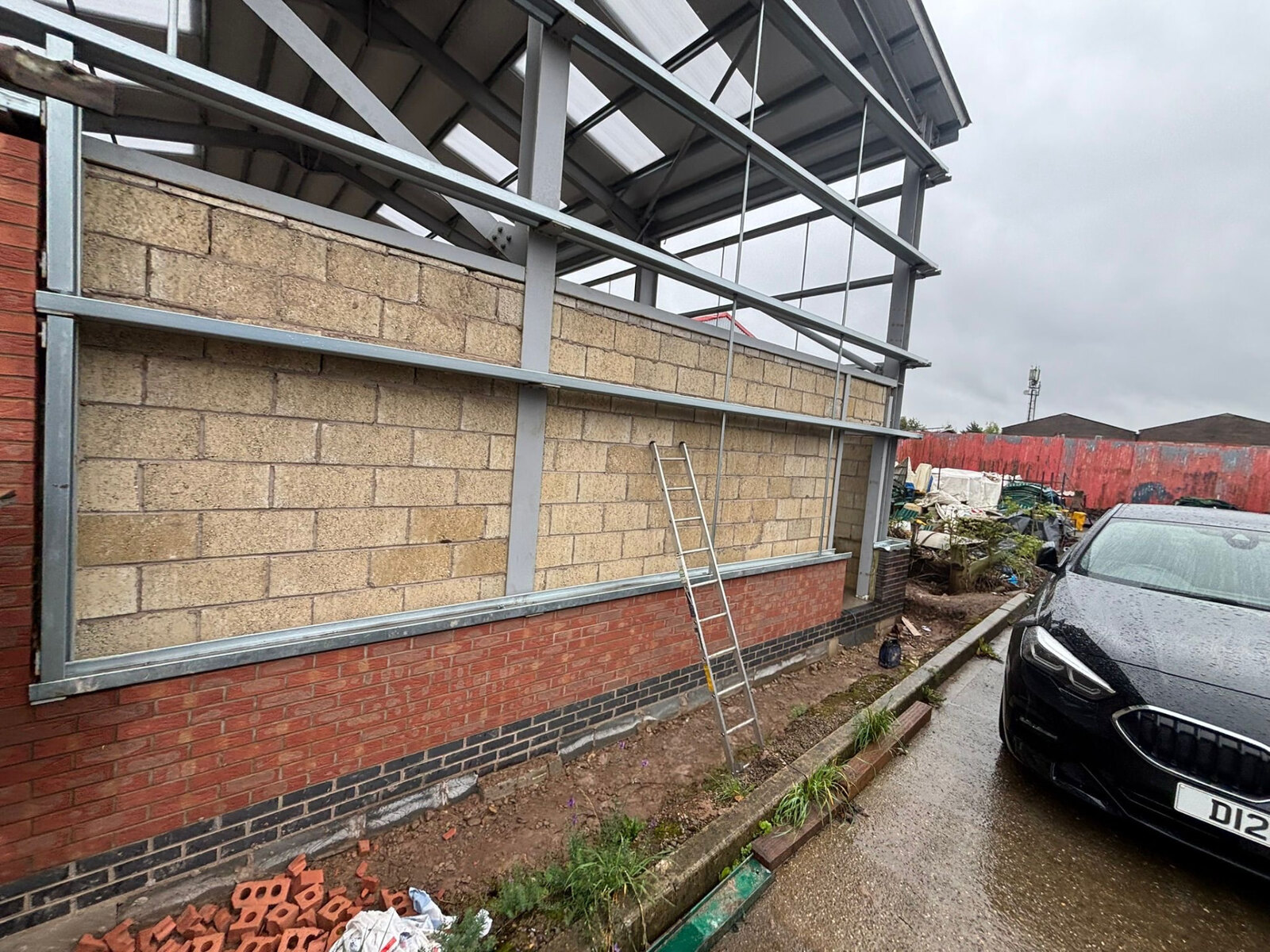 Blockwork and brick plinth infill walls to a steel portal frame commercial building